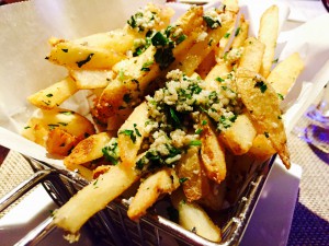 A basket of hot crispy truffle fries with Parmesan/Alex Province 
