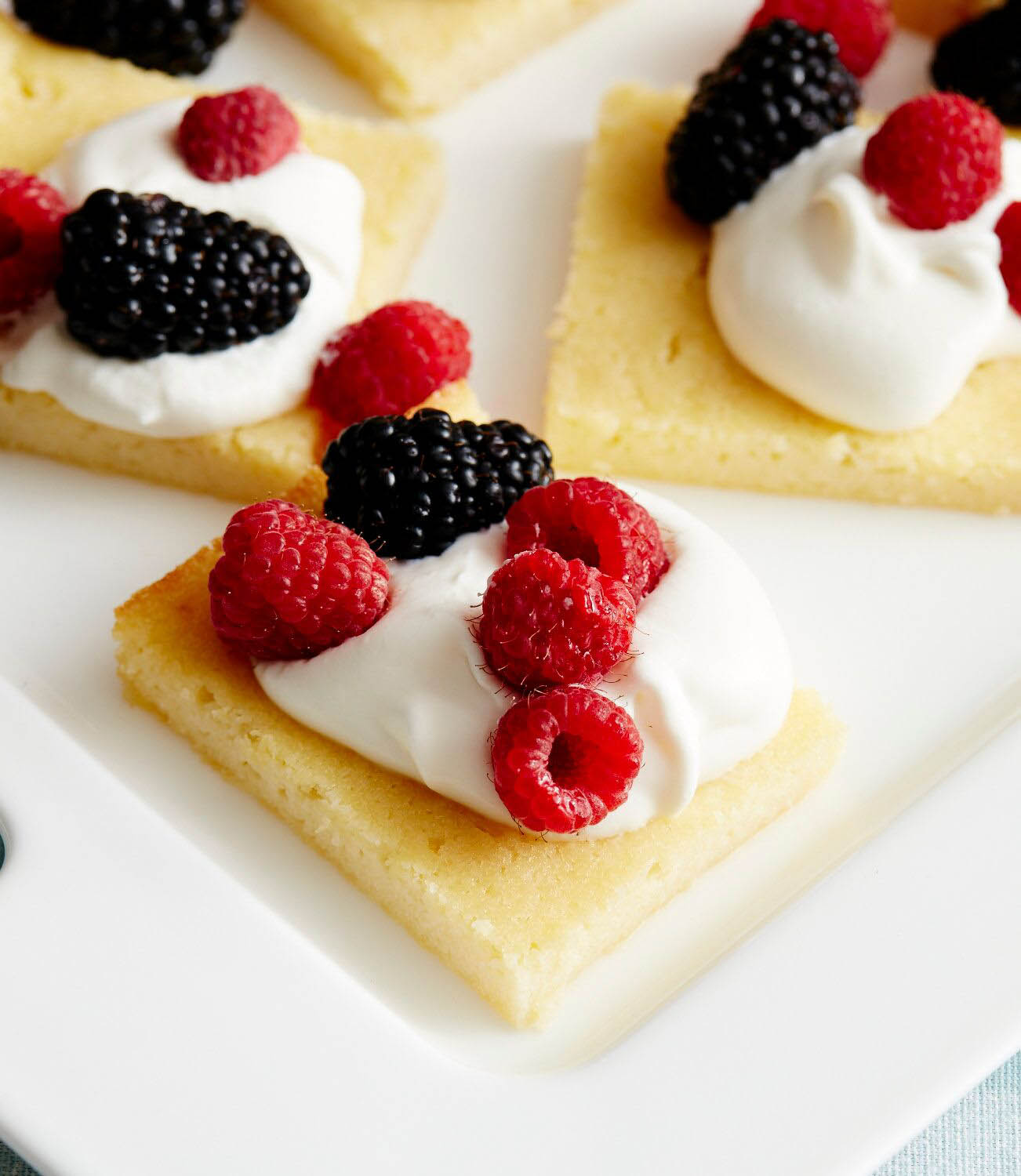 Lemon Ricotta Cake with Sweetened Whipped Cream and Berries · Faith Middleton's Food Schmooze